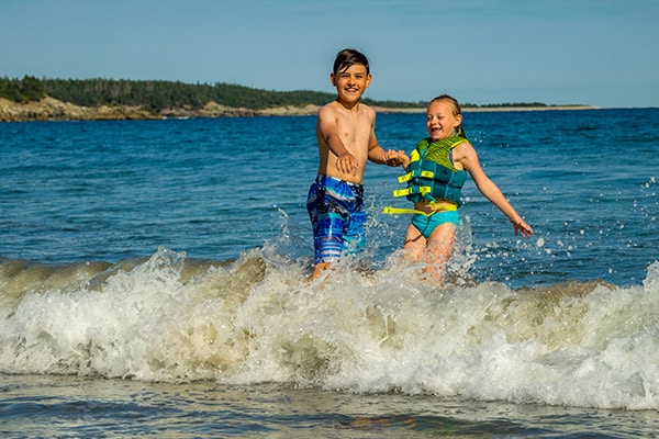 Kids are having fun at the beach, Cape Breton Island, Canada